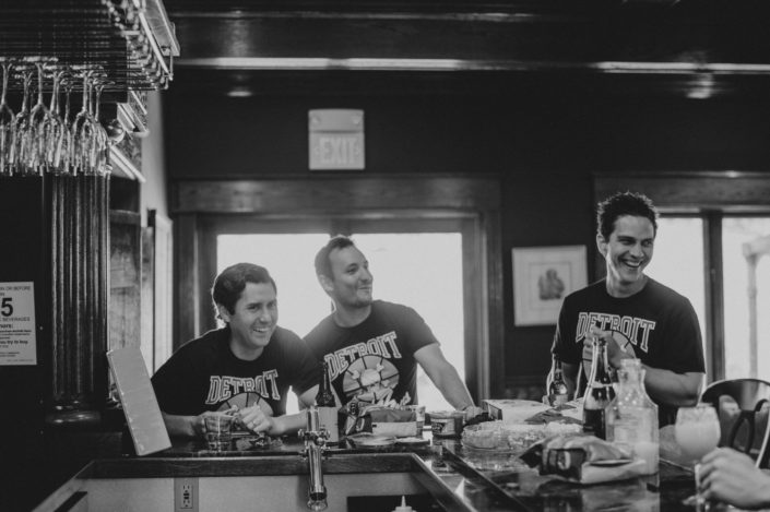 Groom and groomsmen getting ready in the Pegasus Lounge at the Inn at Black Star Farms.