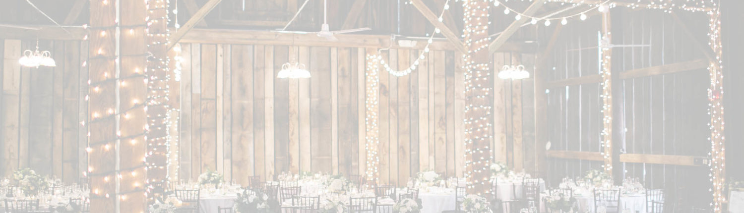 Pegasus Barn with decorated tables and lights.