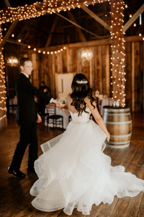 Bride and Groom taking their first dance at the Pegasus Barn at Black Star Farms Suttons Bay.