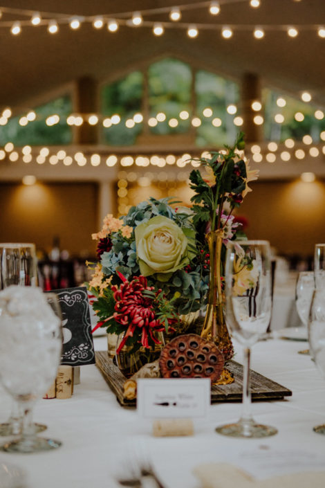 Fall flower arrangement on wedding reception table in the Aquarius Room.