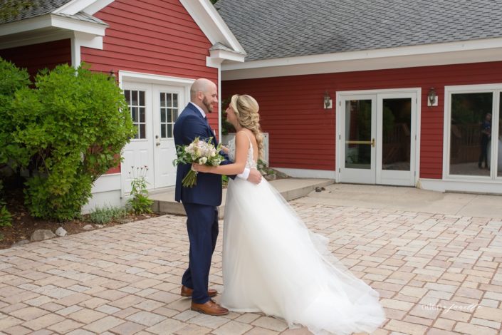 Wedding couple first look on the stone patio at the Inn at Black Star Farms.