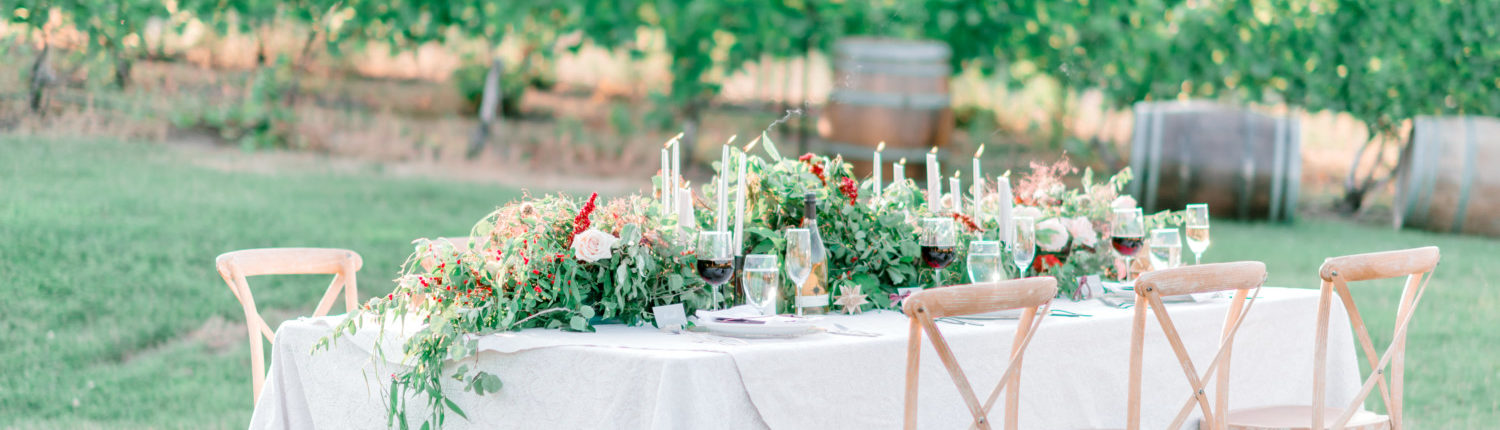 Lavishly set wedding party table in the vineyard at Black Star Farms Suttons Bay.