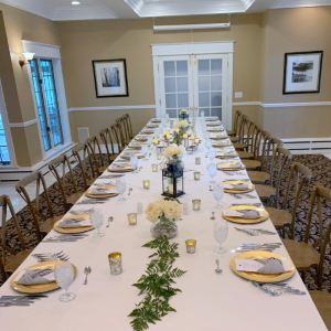 The Arcturos Room with table set up for a small wedding reception dinner.