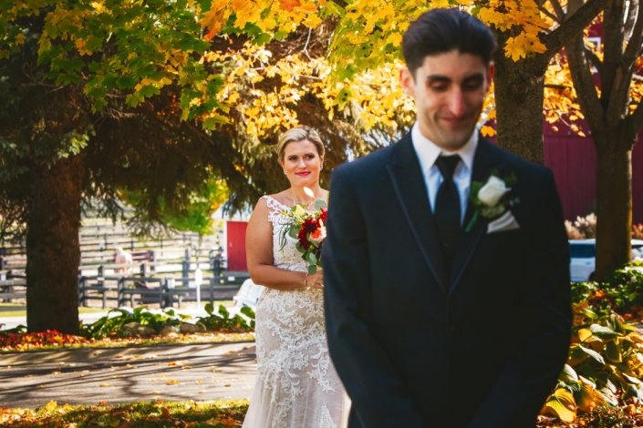 First look bride and groom with horse paddocks.