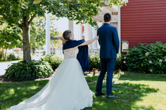 Wedding couple at first look at one of the top-rated Traverse City wedding venues