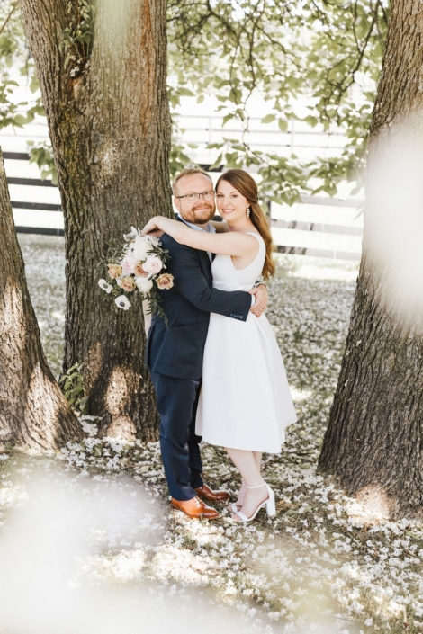 Elopement couple under a tree.