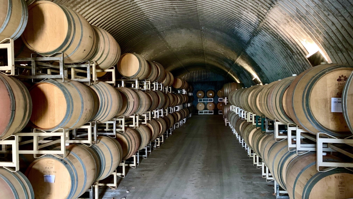 Wine barrels aging in the cave.