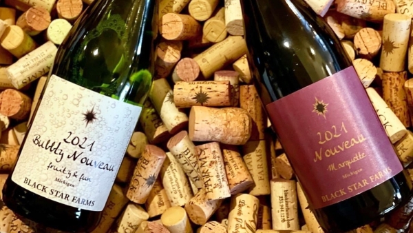 A bottle of Bubby Nouveau and Nouveau Marquette on corks.