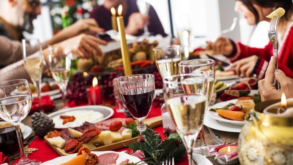 Family enjoying a holiday dinner with wine.
