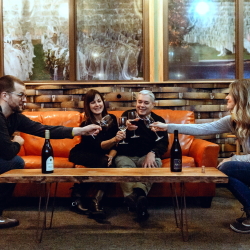 couples enjoying wine in the Barrel Room.