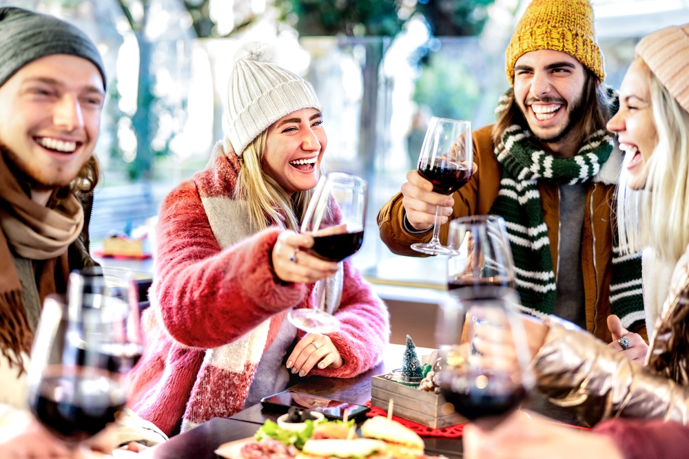 Group of young friends enjoying a winter wine tasting on the Leelanau Peninsula Wine Trail