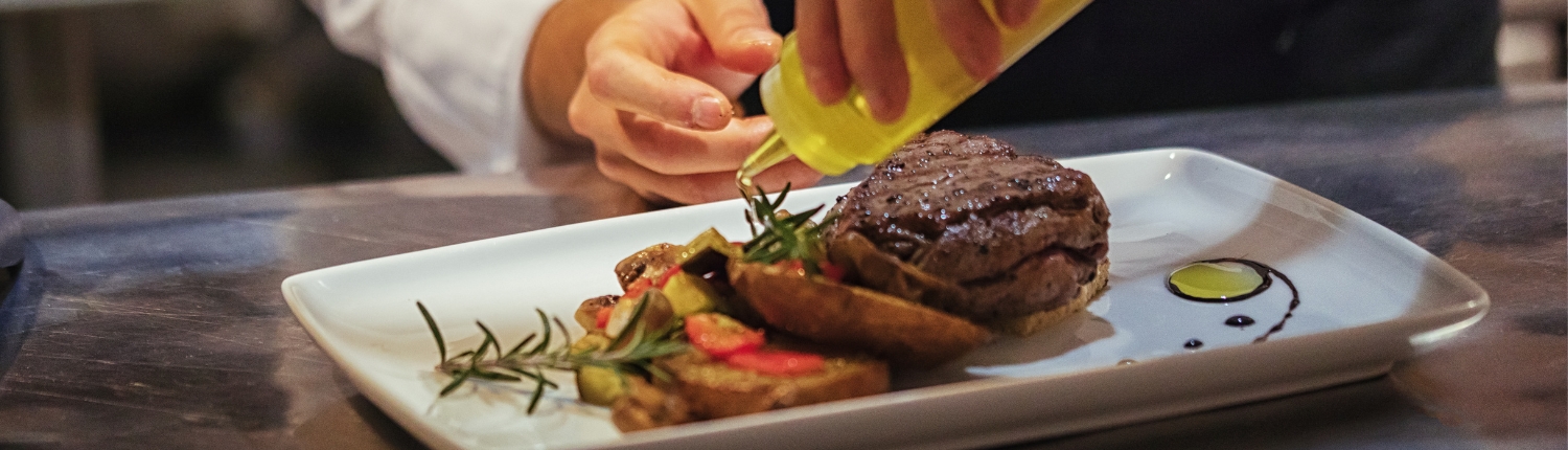 Chef preparing a great meal at Polaris, one of the best Traverse City Restaurants